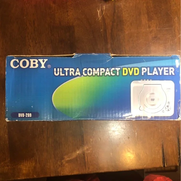 Coby DVD Player Ultra Compact DVD 209 Top Loading With Remote Control - Av Cable